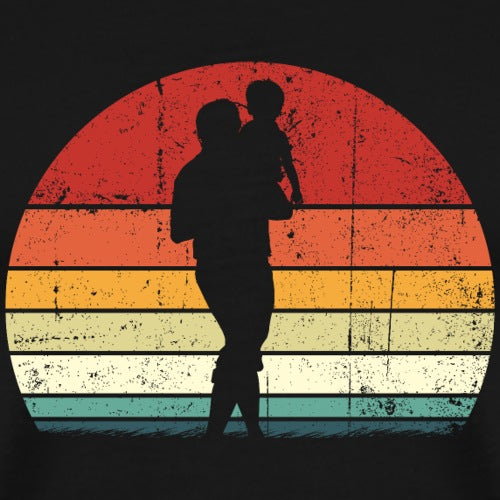 Silhouette of a father holding a child against a colorful, sunburst background.