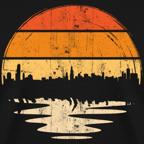 City skyline silhouette with a large orange sun in the background