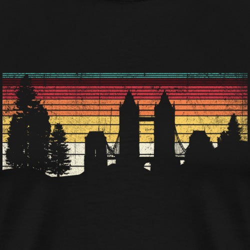 Silhouette of a bridge and trees against a colorful sunset sky on a black background