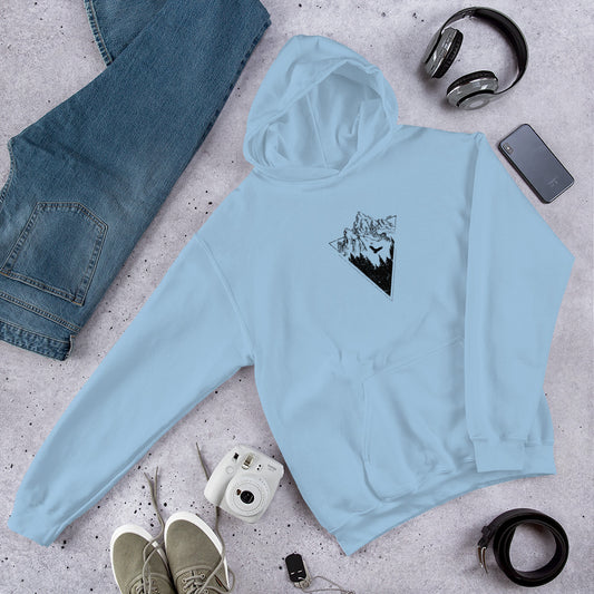 Light blue hoodie with a black graphic on a gray surface with jeans, shoes, camera, and accessories.