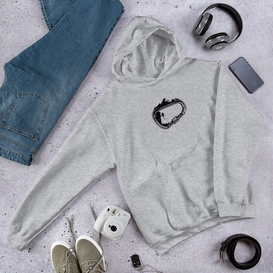 Grey hoodie with Carabiner Climbing design on grey surface with jeans, shoes and accessories.