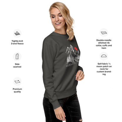 Woman wearing a dark gray sweatshirt with a mountain sketch forest graphic, surrounded by text detailing sweatshirt features.